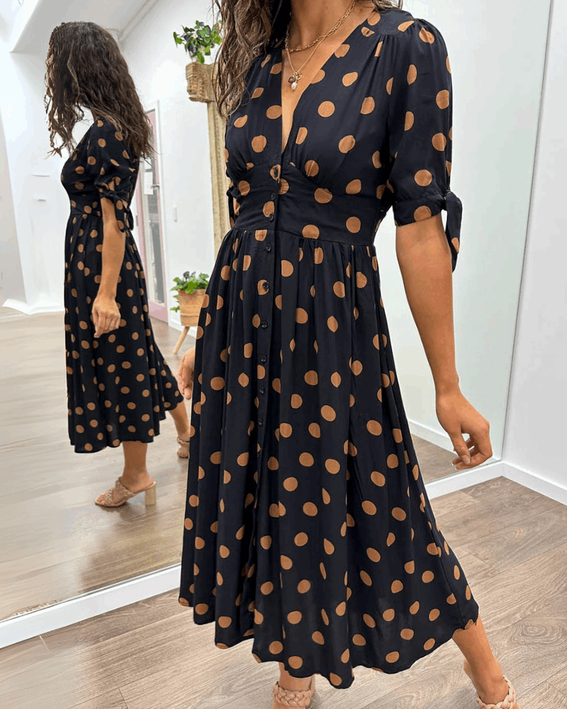 ANKA | Polka dot dress with flared hem and accentuated waist