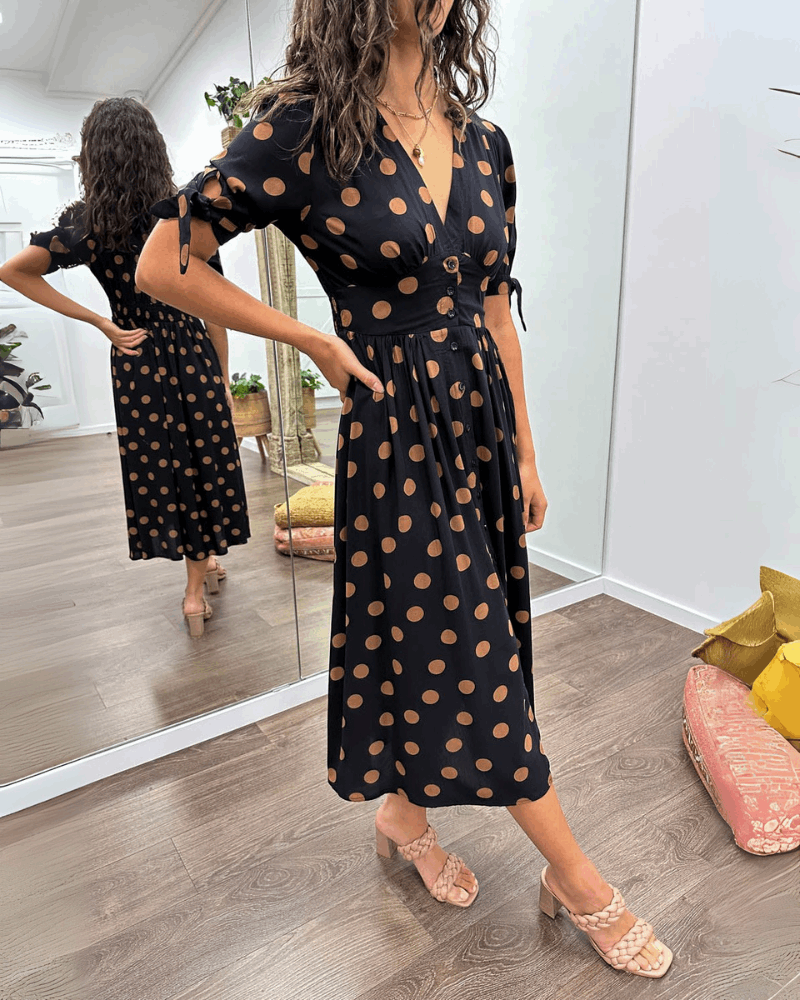 ANKA | Polka dot dress with flared hem and accentuated waist