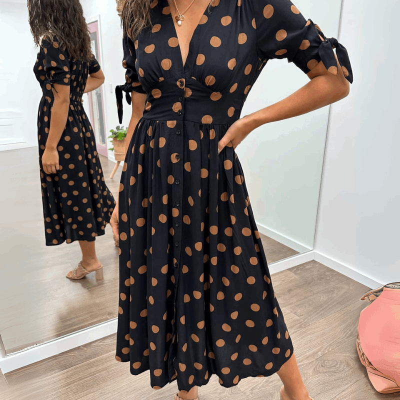 ANKA | Polka dot dress with flared hem and accentuated waist