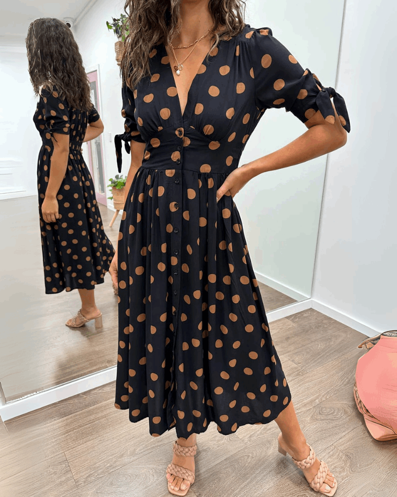 ANKA | Polka dot dress with flared hem and accentuated waist